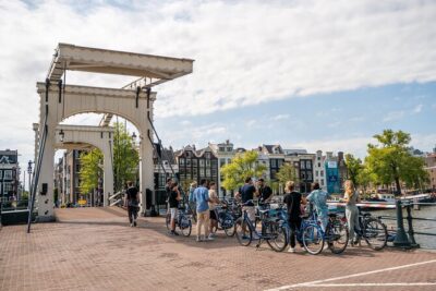 Amsterdam Small-Group Bike Tour With Optional Canal Cruise - Meeting Point at Nieuwezijds Voorburgwal: Close to the action