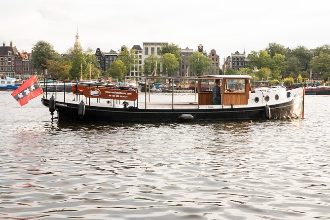 Amsterdam Small-Group Canal Cruise With Dutch Snacks and Drink - What makes this cruise work: small group, close canals, real guide energy
