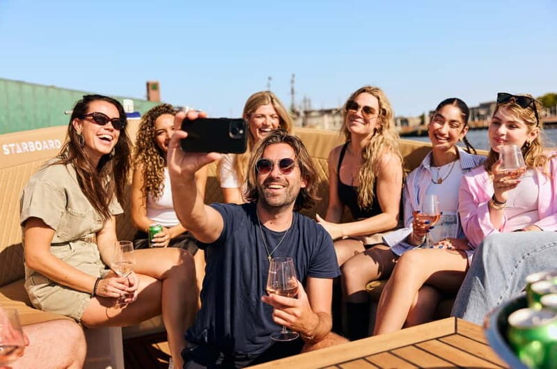 Amsterdam: Spanish Guided Open Boat Cruise with Bar Onboard - The main route: Skinny Bridge, the Canal Belt, and Herengracht