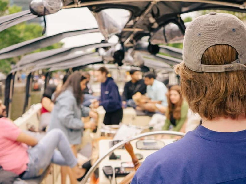 Amsterdam: Spanish Guided Open Boat Cruise with Bar Onboard - Hermitage Museum views and the Amstel Hotel along the way