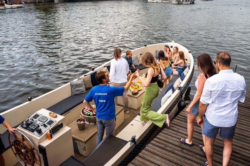 Amsterdam: Spanish Guided Open Boat Cruise with Bar Onboard - Onboard experience: Spanish narration, skipper, and your drink stop