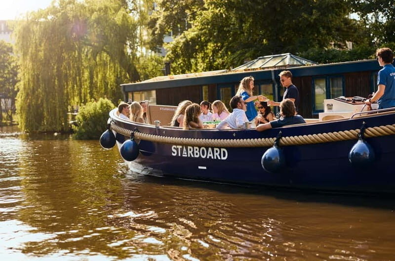 Amsterdam: Spanish Guided Open Boat Cruise with Bar Onboard - Meeting Starboard Boats without losing your time