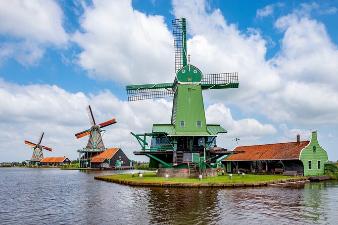 Amsterdam: Windmills, Cheese and Volendam Tour with Video Guide - Volendam by the IJsselmeer: harbor views and quick local food