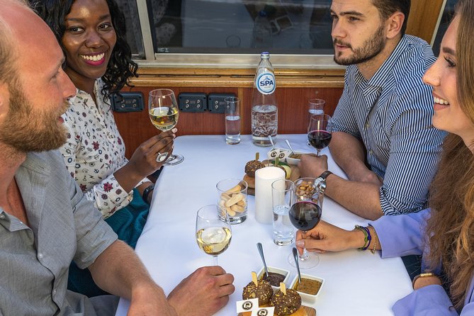 Amsterdam Wine and Cheese Evening Cruise - The guide and the onboard vibe: where experiences differ