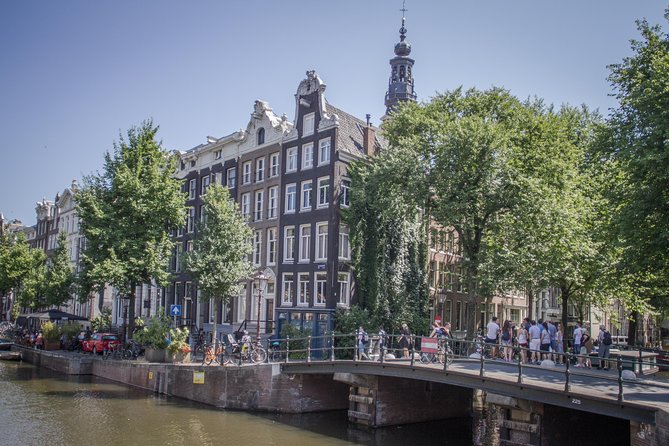 Anne Frank Private Bike Tour in Amsterdam - Spinoza Monument pause: a short stop that resets your pace