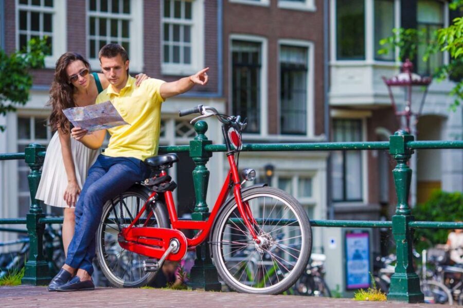 Bike Tour of Amsterdam Old Town, Top Attractions and Nature - Dam Square to Central Station: Royal Palace Views, New Church, and the Floating Flower Market