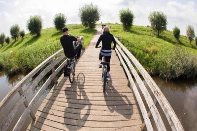Cheese, Canals & Windmill Countryside E-Bike Tour Amsterdam - The Ferry Start: Amsterdam Centraal to Amsterdam North via the IJ