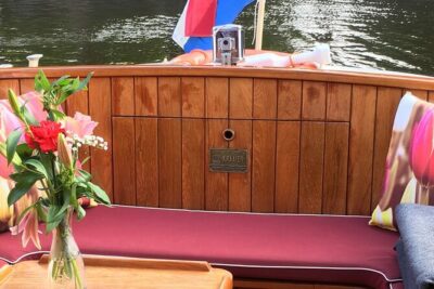 Cruise Amsterdam like a Local — Small Group 12 pax - Boat comfort in cool Amsterdam: heated saloon, blankets, and the right kind of coziness
