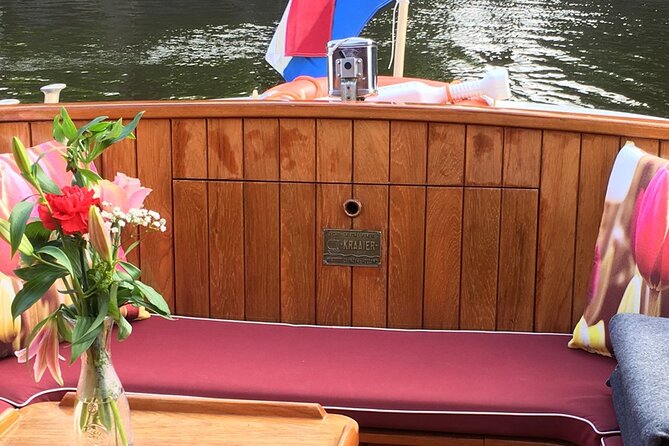 Cruise Amsterdam like a Local — Small Group 12 pax - Boat comfort in cool Amsterdam: heated saloon, blankets, and the right kind of coziness