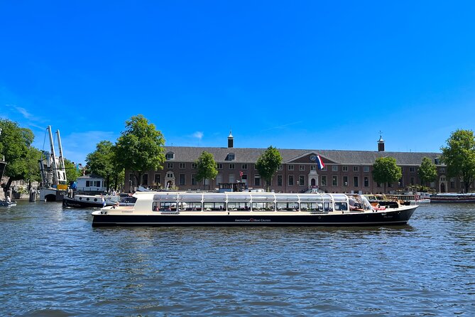 Discover Amsterdam: Luxury Canal Cruise with a Local Skipper - Older buildings and museum stops: 400 years old, then Tech-on-the-rooftop vibes