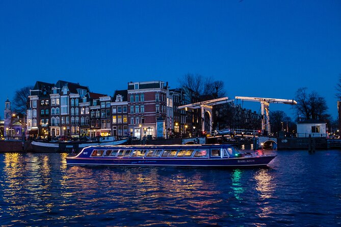 Evening Canal Cruise in Amsterdam with Wine & Cheese Option - Westerkerk and Amsterdam Centraal: big architecture, best seen from the water