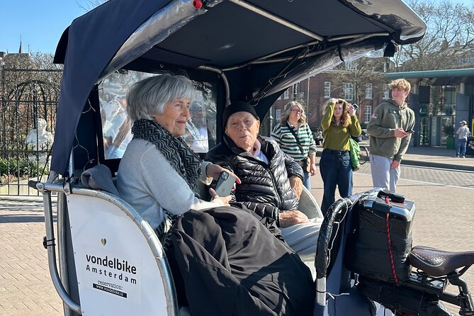 Explore Amsterdam in 75 Minutes – Pedicab Rickshaw City tour - Magere Brug and the Amstel views: included photo time that feels like Amsterdam