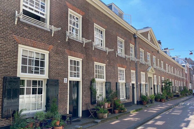 Explore hidden streets with friends - Private Tour - Crossing the Amsterdam Canal Ring like you’re reading a timeline