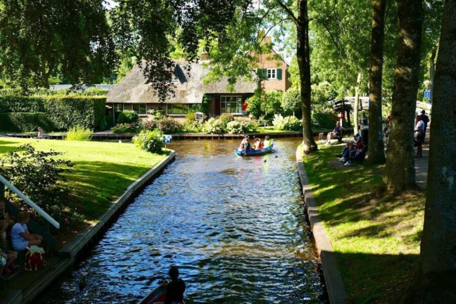 From Amsterdam: Private Tour to Giethoorn with Canal Cruise - Giethoorn by water: choosing canal cruise vs. sailing yourself