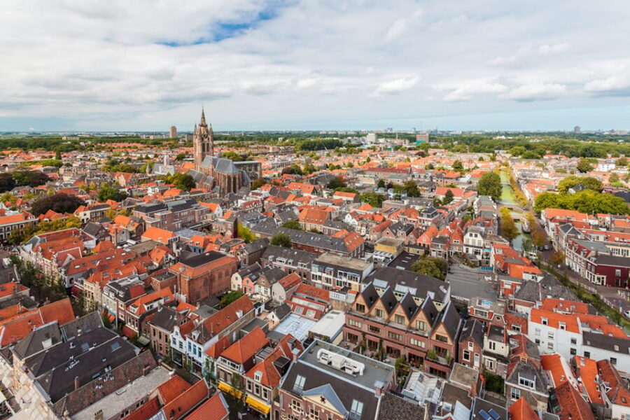 From Amsterdam: Rotterdam, The Hague & Delft Private Tour - Delft’s canals and Vermeer: pottery town with film-location charm