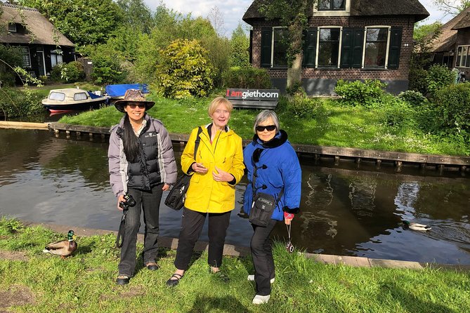 From Amsterdam: Zaanse Schans, Volendam, Giethoorn with Boat Tour - Volendam Haven: Wooden Houses, Harbor Photos, and Traditional Dress