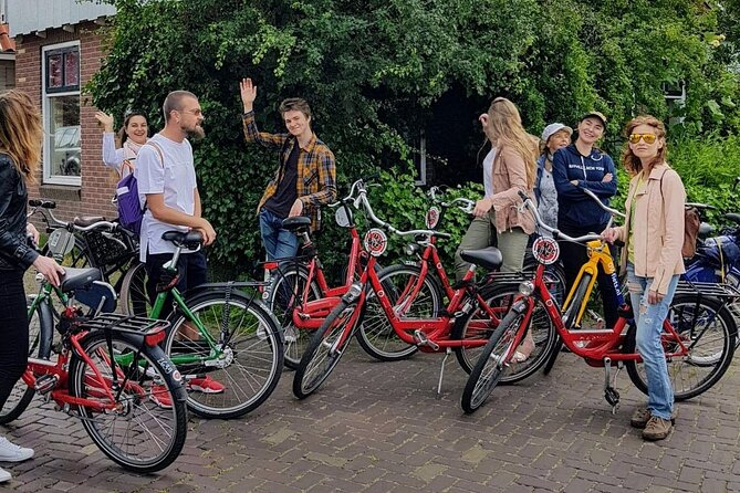 Full-Day Private Guided Countryside Tour from Amsterdam by Bike - Nieuwendammerdijk: wooden houses, dyke lore, and a coffee stop