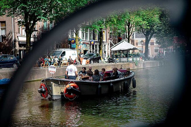 Guided Amsterdam Canal Cruise – Snacks & Drinks on board(1 Hour) - Neighborhood moments that hit hard: culture, plants, and the Herengracht elite