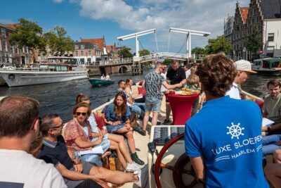Haarlem Open-Boat Canal Cruise with Live Guide (Electric Boat) - Your Boat Setup: Open, Cushioned, and Quiet on the Spaarne