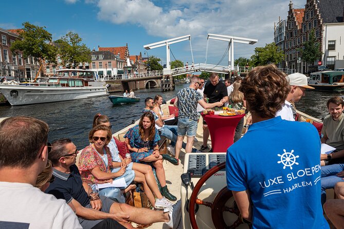 Haarlem Open-Boat Canal Cruise with Live Guide (Electric Boat) - Your Boat Setup: Open, Cushioned, and Quiet on the Spaarne