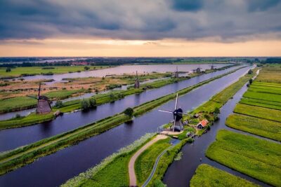 Kinderdijk Windmills and Delft Small-Group Tour from Amsterdam - The boat ride near Kinderdijk: a calmer view, and better angles