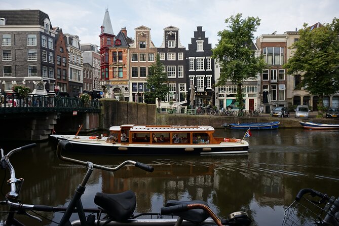 Morning Canal Cruise Amsterdam in Small-Group - The 1928 saloon boat: comfort first, not just sightseeing photos