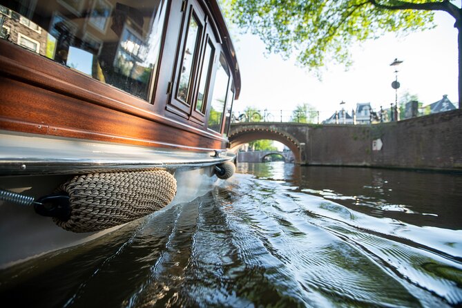 Private Boat Tour Amsterdam - 90 Min incl. welcome drink on historic saloon boat - A Smooth Amsterdam Plan: Pair It With Dinner and a Short Walk
