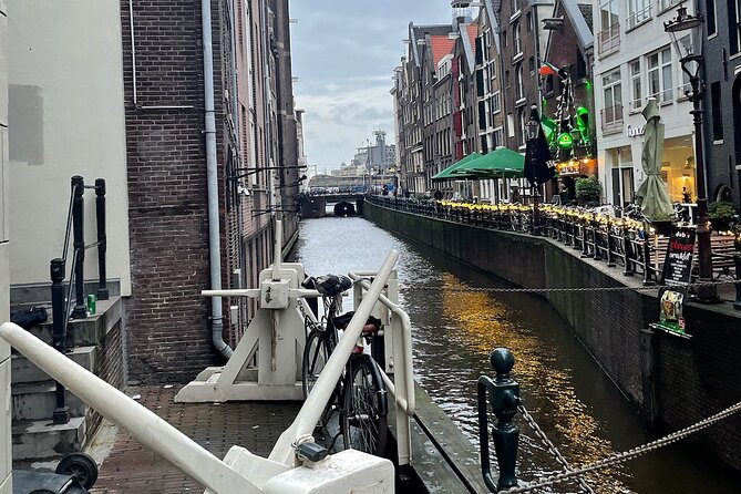 Private Walking Tour of Amsterdam - The Highest Tower, a WWII Monument, and a Courtyard Story That Stops You Cold