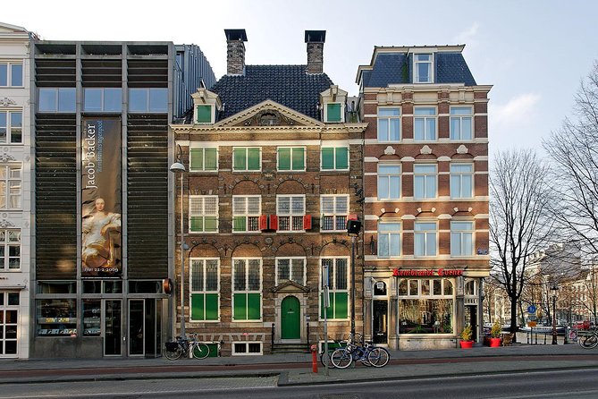 Rembrandt House & Neighborhood Guided Tour Semi-Private 8ppl Max - Bloemenmarkt, Munttoren, and Rembrandtplein: a fast hit of street-level Amsterdam
