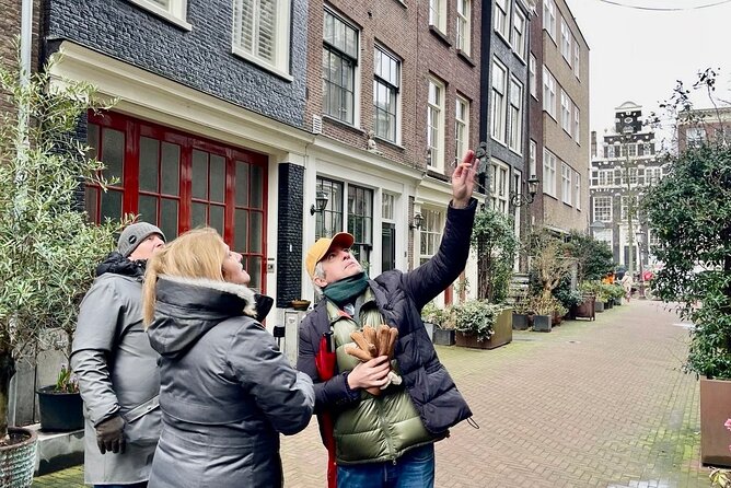 Small Group Walking Tour in Amsterdam with Friendly and Fun Guide - Canals and the 17th century: seeing why Amsterdam is built the way it is