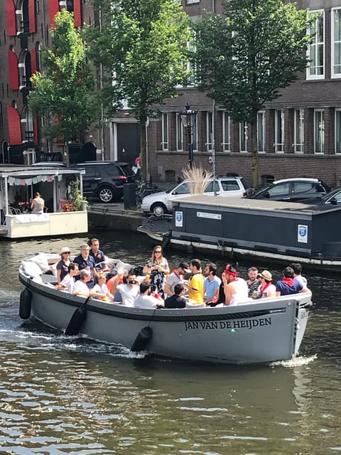 Visit Amsterdam by Boat with a French Guide (french) - Small Electric Boat Setup: Comfortable, Quiet, and Photo-Friendly